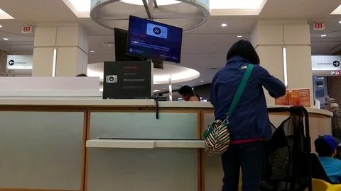 Motion of people returning cart at customer service counter Video stock 75588131
