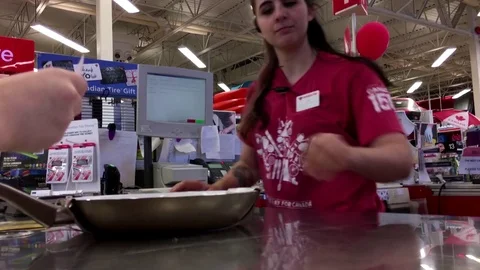 Motion of people returning frying pan at customer service counter Stock Footage 77695259