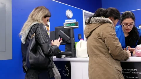 Motion of people returning items at customer service counter Video stock 85548153