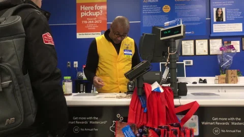 Motion of people returning items at customer service counter Stock Footage 105052197