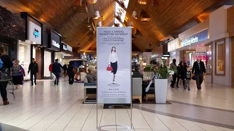 Motion of people shopping inside Coquitlam shopping mall Stock Footage 75794714