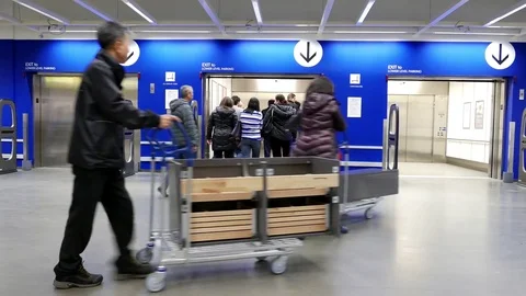 Motion of people taking elevator inside Ikea store with 4k resolution Stock Footage 73851818