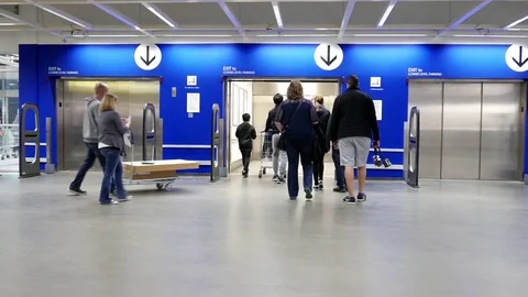 Motion of people taking elevator inside Ikea store with 4k resolution Video stock 73878577