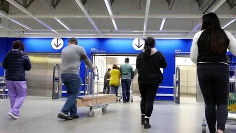 Motion of people taking elevator inside Ikea store with 4k resolution Video stock 73943853