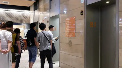 Motion of people taking elevator inside shopping mall Video stock 95700703