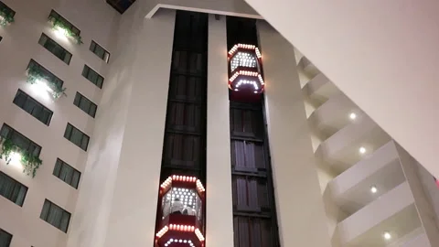 Motion of people taking elevator inside the shopping mall in Taiwan Stock Footage 102588795