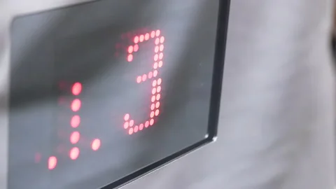 Motion of people taking elevator from three to B1 floor Stockbeeldmateriaal 100131085