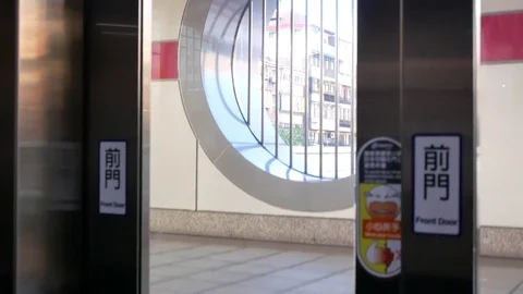 Motion of people taking elevator from two to one floor inside the MRT platform Stock Footage 85190826