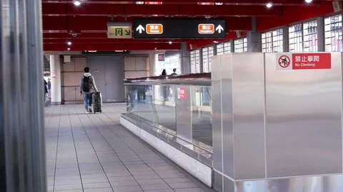 Motion of people taking elevator from two to one floor inside the MRT platform Stock Footage 85196345