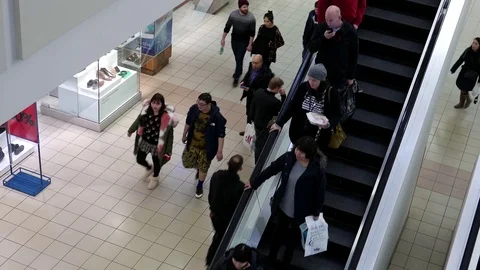 Motion of people taking escalator inside Burnaby shopping mall Stock Footage 70953391