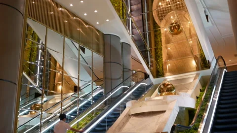 Motion of people taking escalator inside the Grand Hyatt hotel Video stock 95057221
