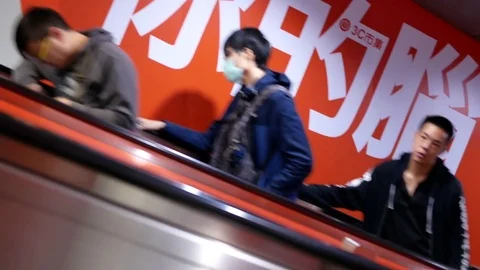 Motion of people taking escalator for taking skytrain at platform Stock Footage 82445031