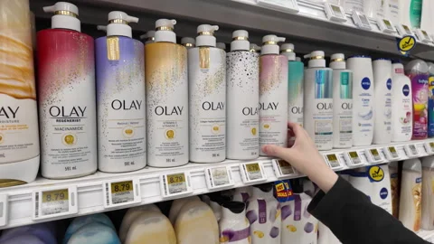 Motion of people taking olay shampoo and conditoner Stock Footage 282554710