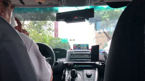 Motion of people taking taxi while car driving on high bump road Video stock 95739445