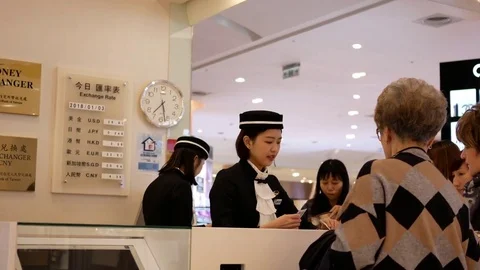 Motion of people talking to the clerk at foreign currency exchange place Stock Footage 84955240