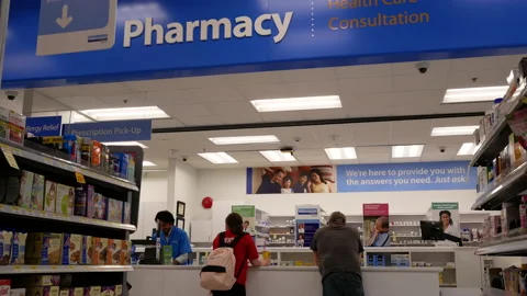 Motion of people waiting for picking up their medicine at pharmacy section Stock Footage 88932322