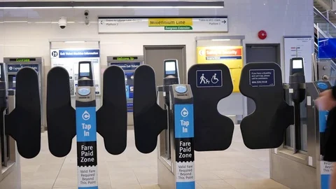 Motion of people walking through the fare pay zone for taking skytrain Video stock 81049977