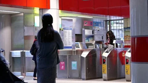 Motion of people walking through the fare pay zone for taking skytrain Stock Footage 82671108
