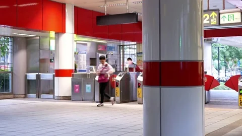 Motion of people walking through the fare pay zone for taking skytrain 스톡 동영상 82701064