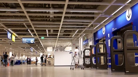 Motion of people walking through main entrance inside Ikea store Video stock 76233443