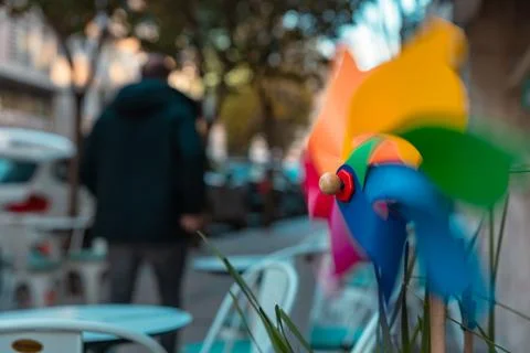 Motion of the pinwheel or windmill in front of a shop or cafe. Stock Photos