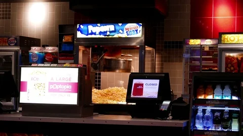 Motion of pop corn machine at food court area inside cinema with 4k resolution Stock Footage 72844943