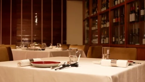 Motion of red wine cabinet with glasses and chopsticks at table Stock Footage 81314429