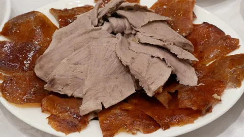 Motion of roasted duck on table inside Chinese restaurant with 4k resolution. Stock Footage 100611519