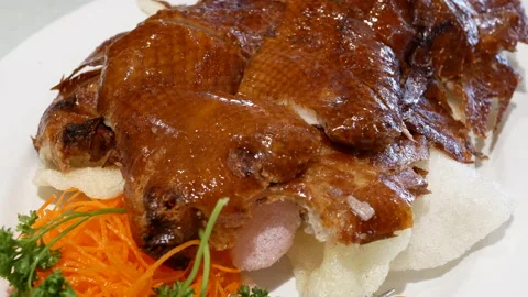 Motion of roasted duck on table inside Chinese restaurant with 4k resolution. Video stock 109516715