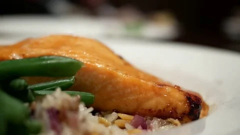 Motion of salmon on plate inside The keg steakhouse and bar Stock Footage 79480682