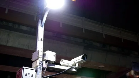 Motion of security cameras and MRT passing on top at night Stock-Footage 84237830