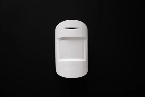 The motion sensor on the black wall. device that tracks the movement of objec Stock Photos