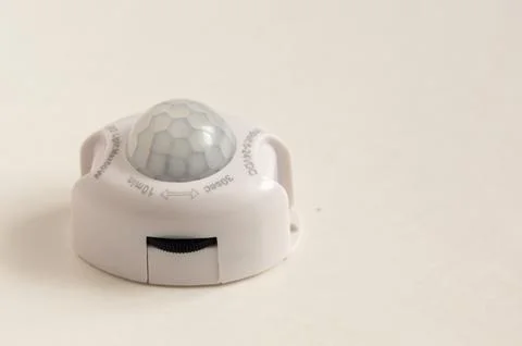 Motion sensor isolated on white background Stock Photos