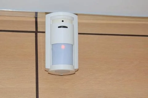 Motion sensor of the security alarm system. A white volume sensor hangs on the Photos