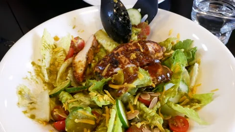 Motion of sesame salad on table inside restaurant with 4k resolution. Video stock 95153616