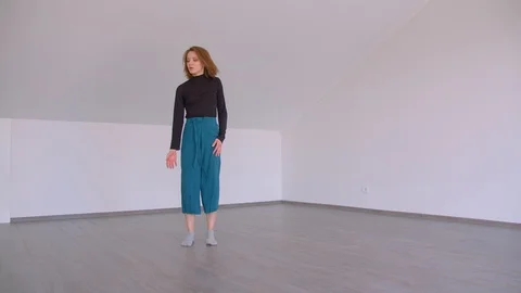 Motion shoot of young beautiful skilled female performing an emotional dance in Stock Footage 110277642
