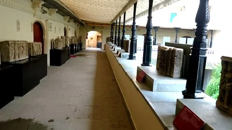 Motion Shot of Ancient Marble Stone Structures Sex Gods on Display Stock Footage 78021660