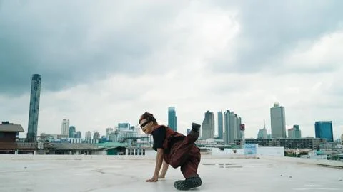Motion shot of B-boy dance performance by professional street dancer. Endeavor. Stock Photos