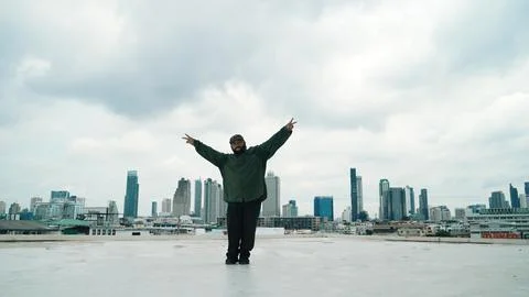 Motion shot of B-boy dance performance by professional street dancer. Endeavor. Stock Photos