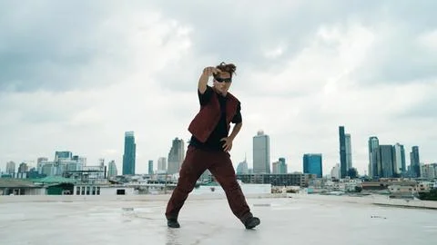 Motion shot of B-boy dance performance by professional street dancer. Endeavor. Stock Photos