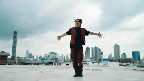 Motion shot of B-boy dance performance by professional street dancer. Endeavor. Stock Photos