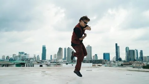 Motion shot of B-boy dance performance by professional street dancer. Endeavor. Stock Photos