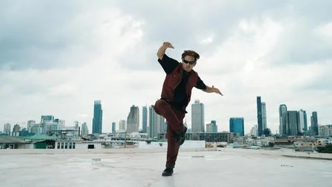 Motion shot of B-boy dance performance by professional street dancer. Endeavor. Stock Photos