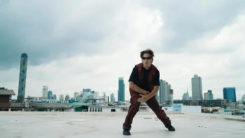 Motion shot of B-boy dance performance by professional street dancer. Endeavor. Stock Photos