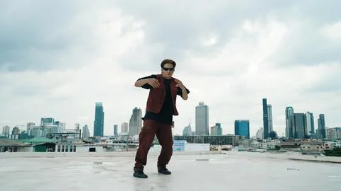 Motion shot of B-boy dance performance by professional street dancer. Endeavor. Stock Photos