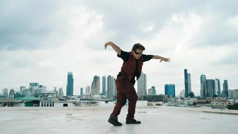 Motion shot of B-boy dance performance by professional street dancer. Hiphop. Stock Photos