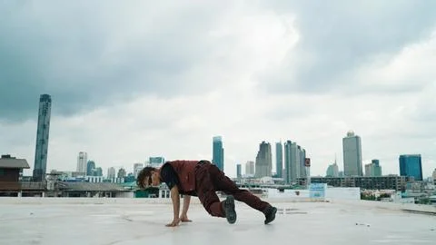 Motion shot of B-boy dance performance by professional street dancer. Hiphop. Stock Photos