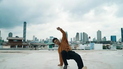 Motion shot of B-boy dance performance by professional street dancer. Hiphop. Stock Photos