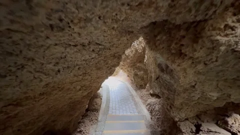 Motion shot of making way through limestone cave Stock Footage 269130782