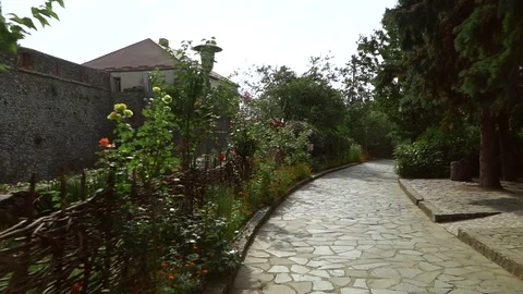 Motion shot of a path to an old fortress with a wooden fence on the way. Stock Footage 119771153